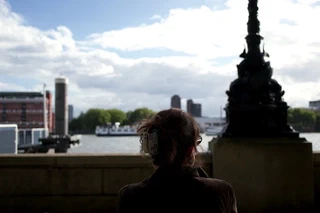 Backlit riverside silhouette looking across the water